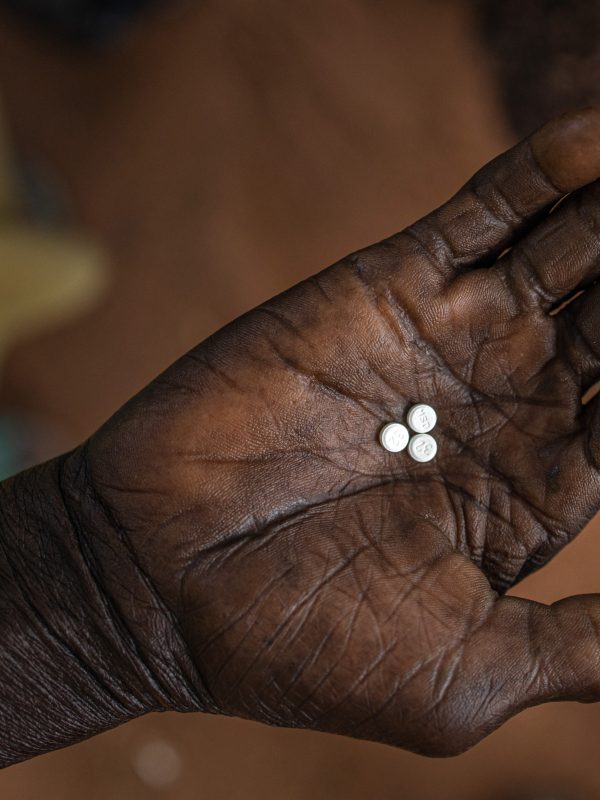 three ivermectin pills in a hand