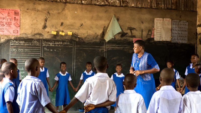 Teacher and students in a Nigerian classroom.