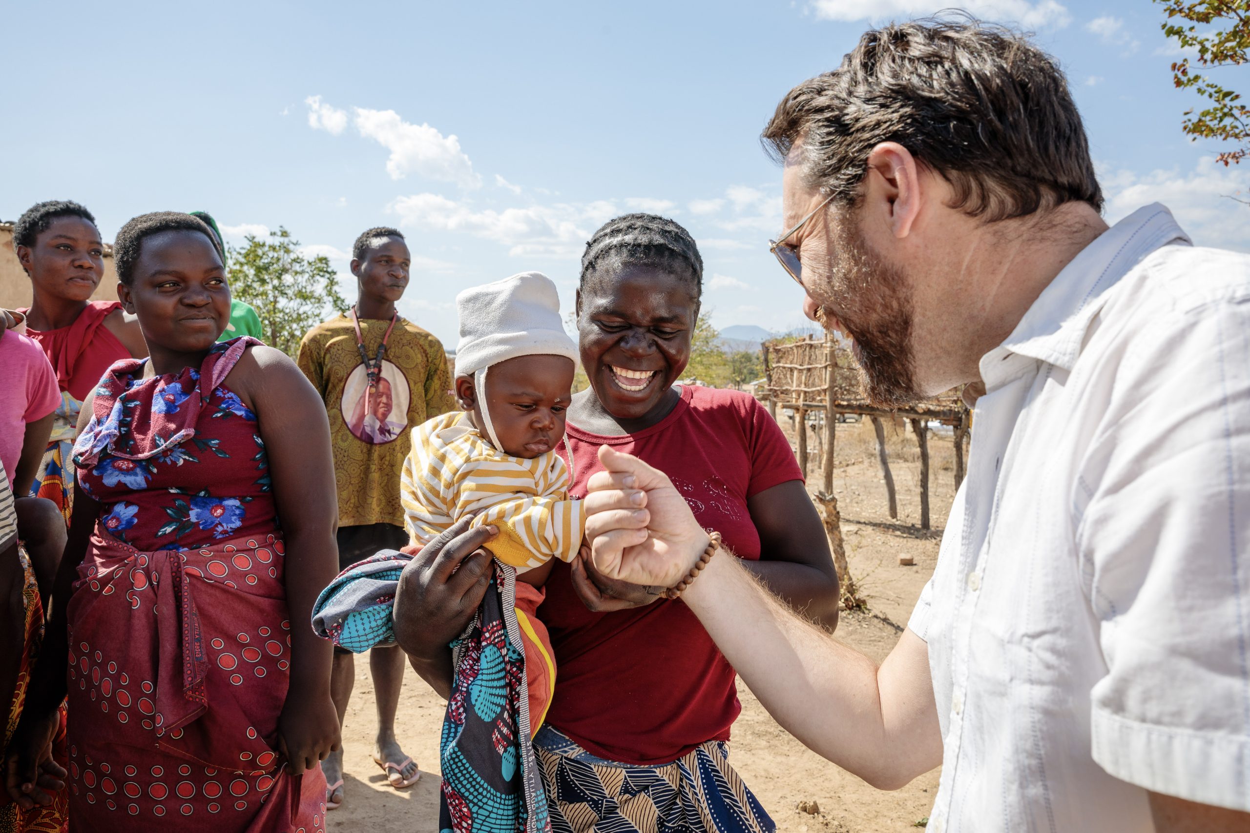 Jason Carter reaches out to a child