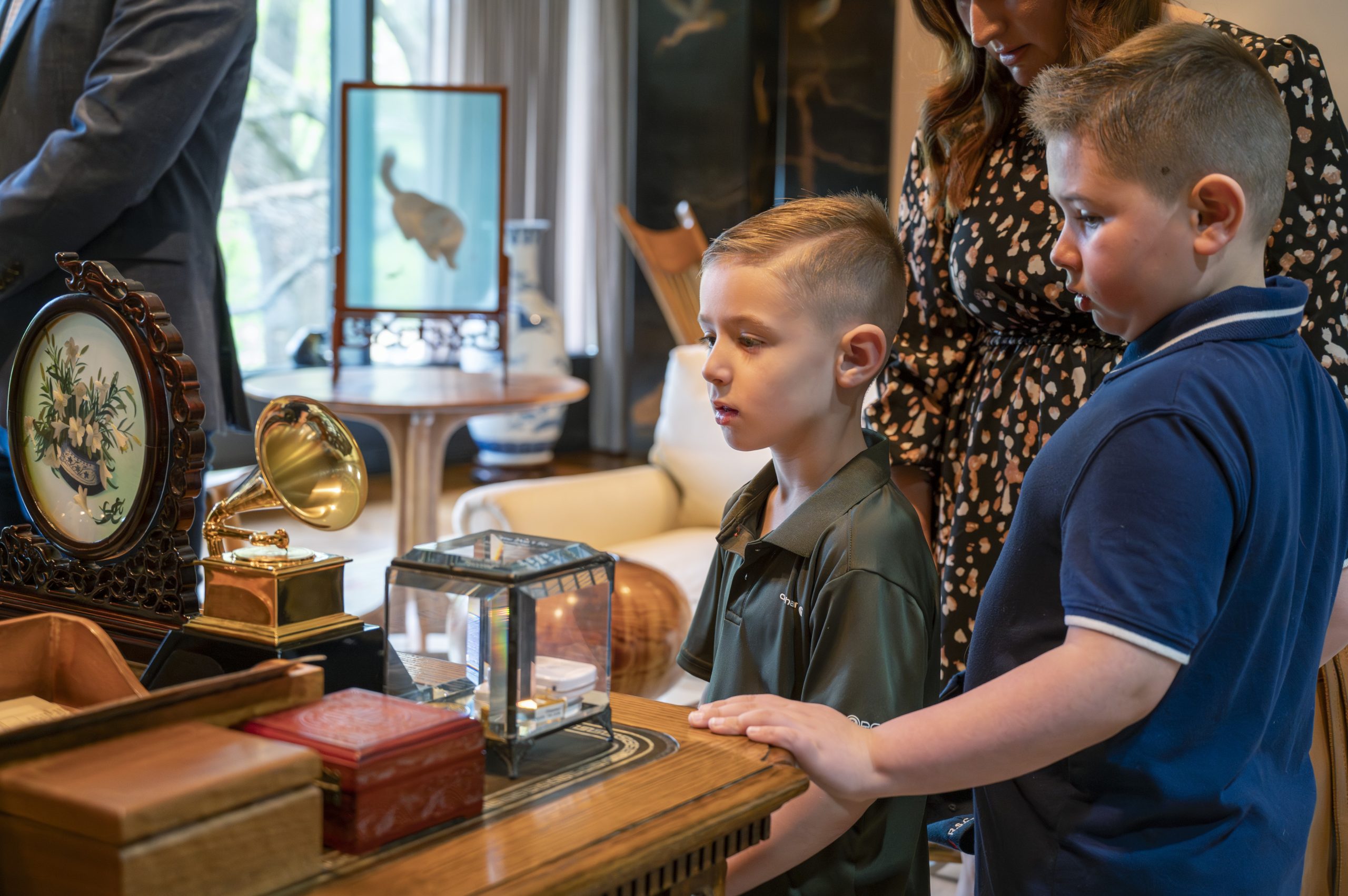 Ryan and CJ stand over President Carter's desk.